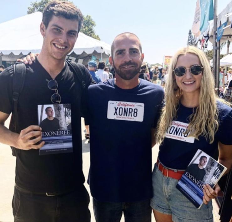 Matti Hurst (right) with exoneree and published author Uriah Courtney (center) at his book signing