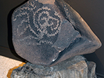 <p>Old Chocolate and Other Surprises: Learning from the May Collection<br />Where is this boulder from? This boulder is one of the more enigmatic pieces in the May Collection. It is what archaeologists call a petroglyph, a design pecked into the surface of the rock to reveal the contrasting material beneath. There is no information about where this piece was obtained, or when it was obtained. Research using modern technology might provide a trace element fingerprint for the rock that would allow some notion of place of origin of the piece.</p><p style="text-align: right;"><em>Photograph by Rose Tyson.</em></p>