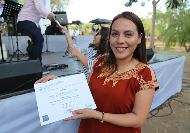 A student receiving her diploma