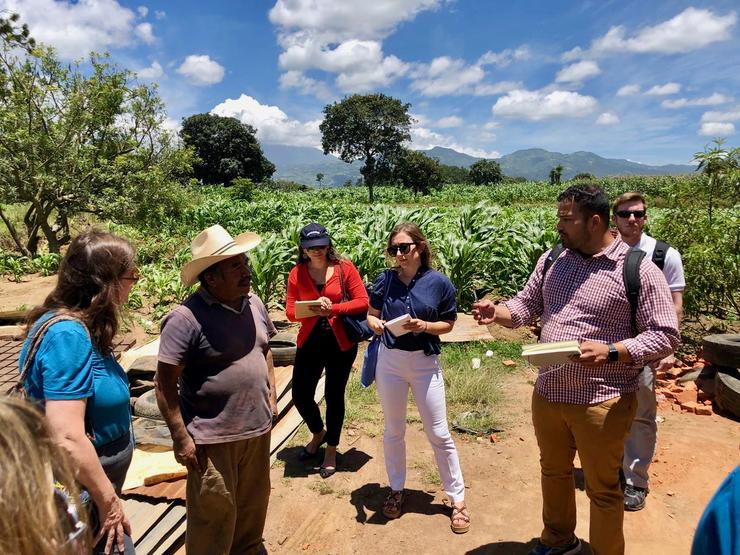 USD students talk to a farmer in Antigua, Guatemala