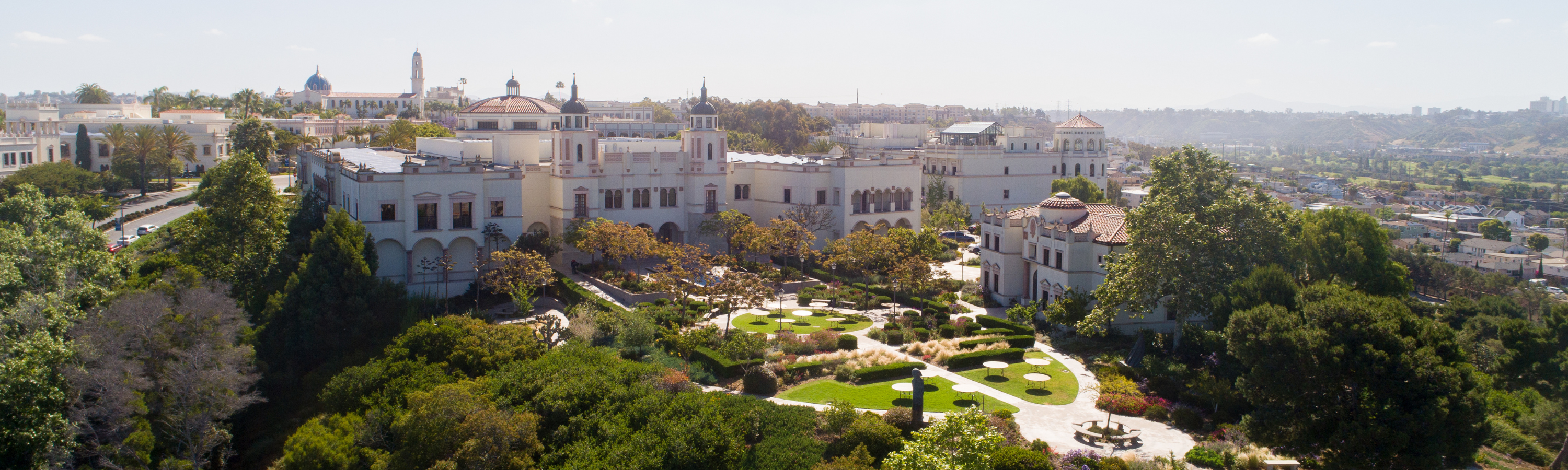 Aerial shot of campus facing east with the Kroc School of Peace in Justice surrounded by greenery