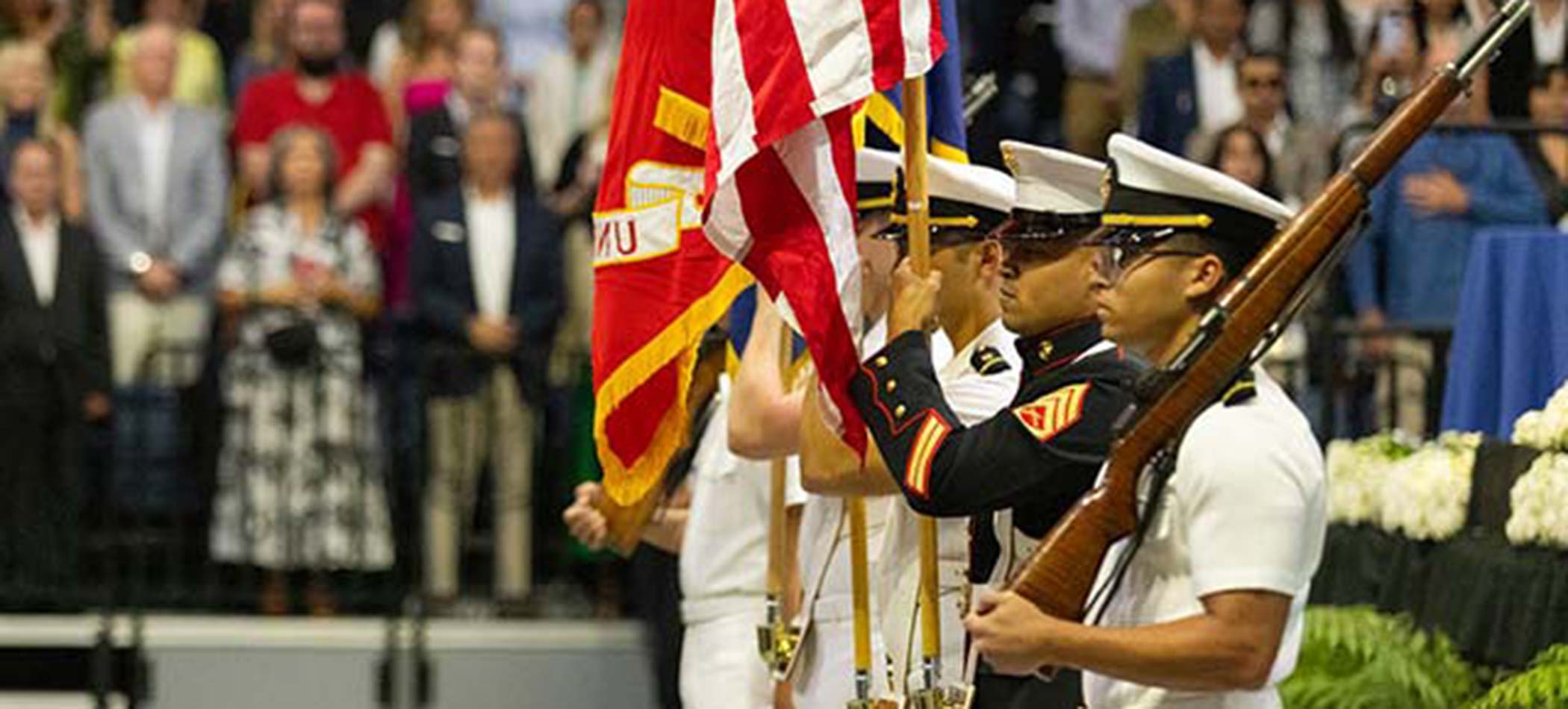 students at alumni veteran network ceremony