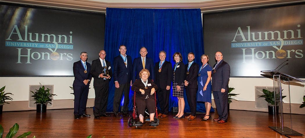 alumni honorees on stage