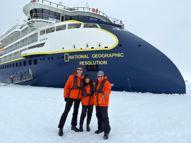 image of people taking photo in front of national geogrpahic ship