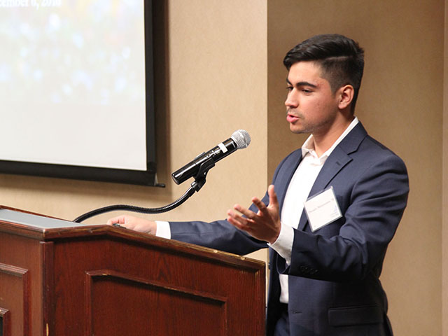Student giving speech at podium