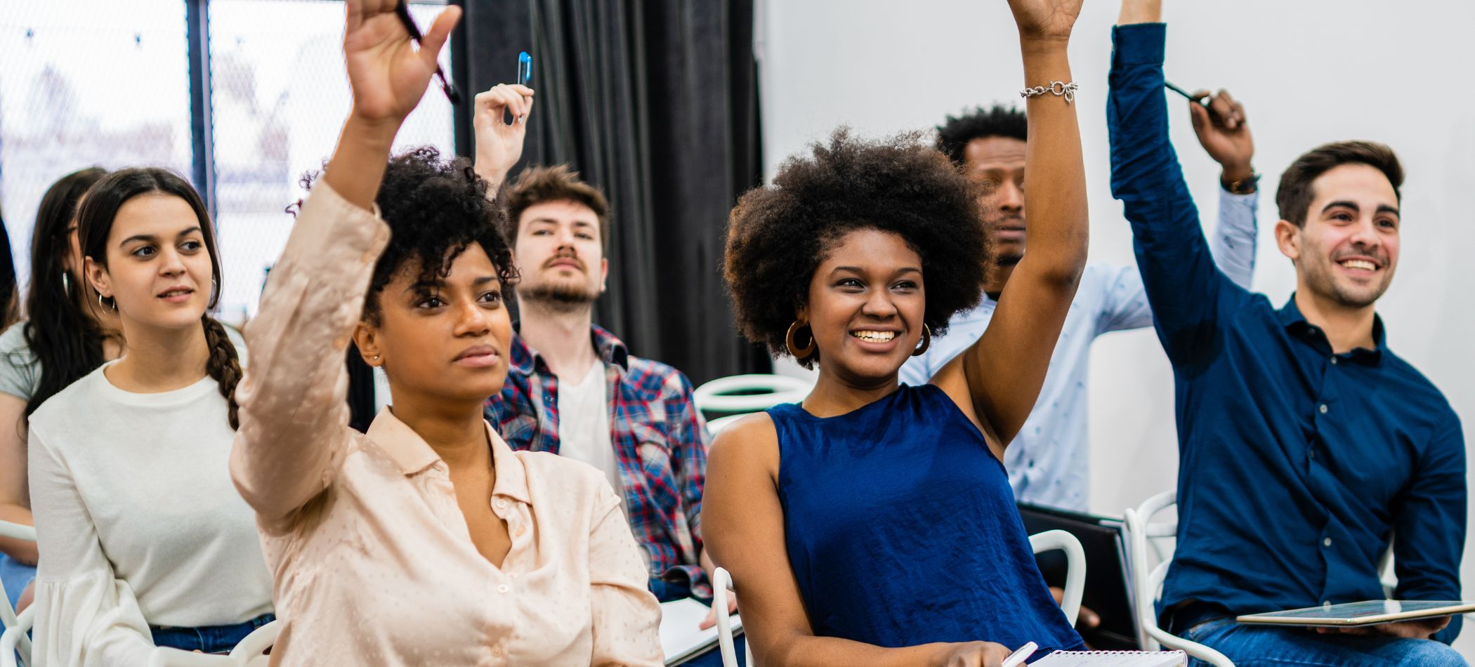 Students raising their hands