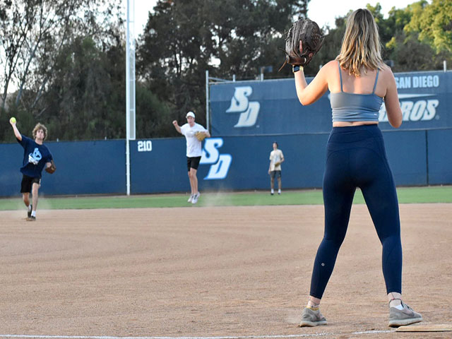 Students playing softball