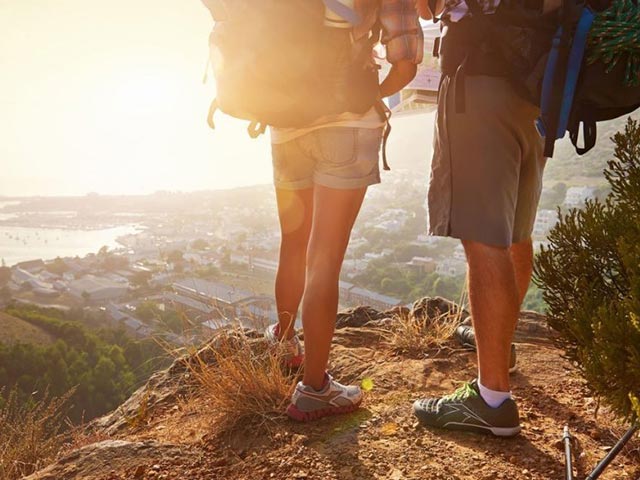 People hiking to the top of a mountain