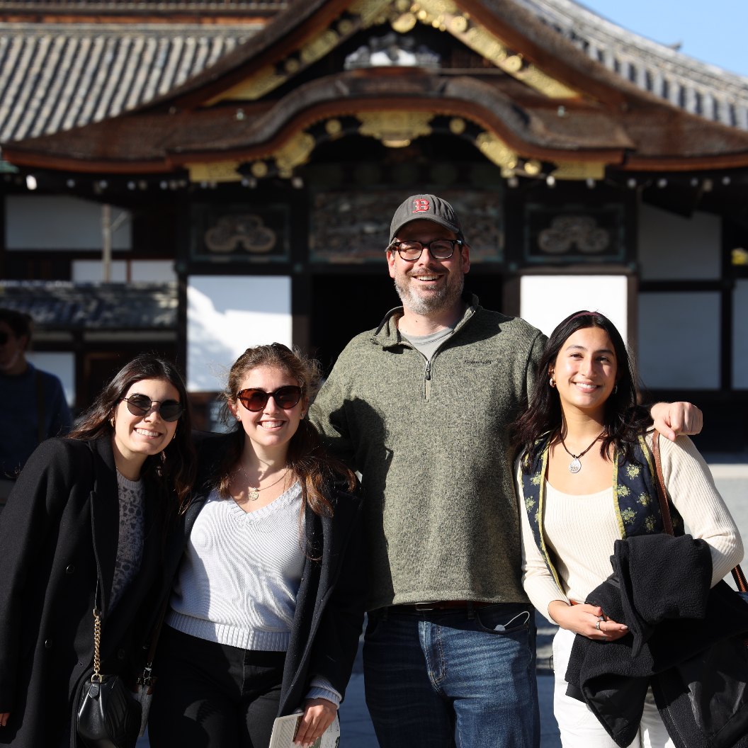 Dr. Tirrell and three students in front of a temple in Japan.