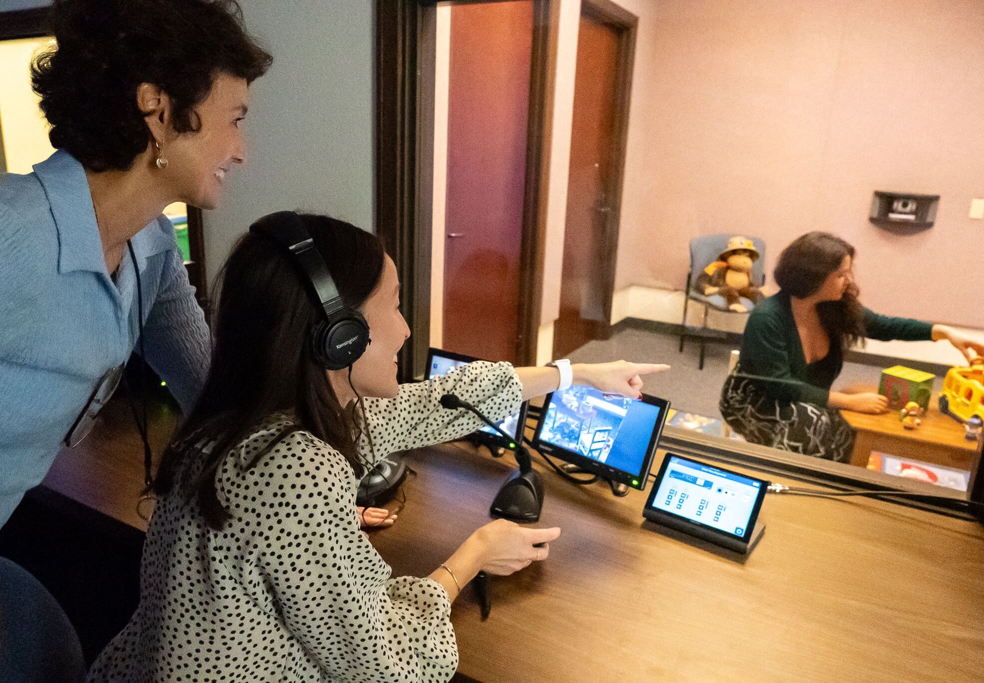 Two USD researchers and a student conducting an experiment.