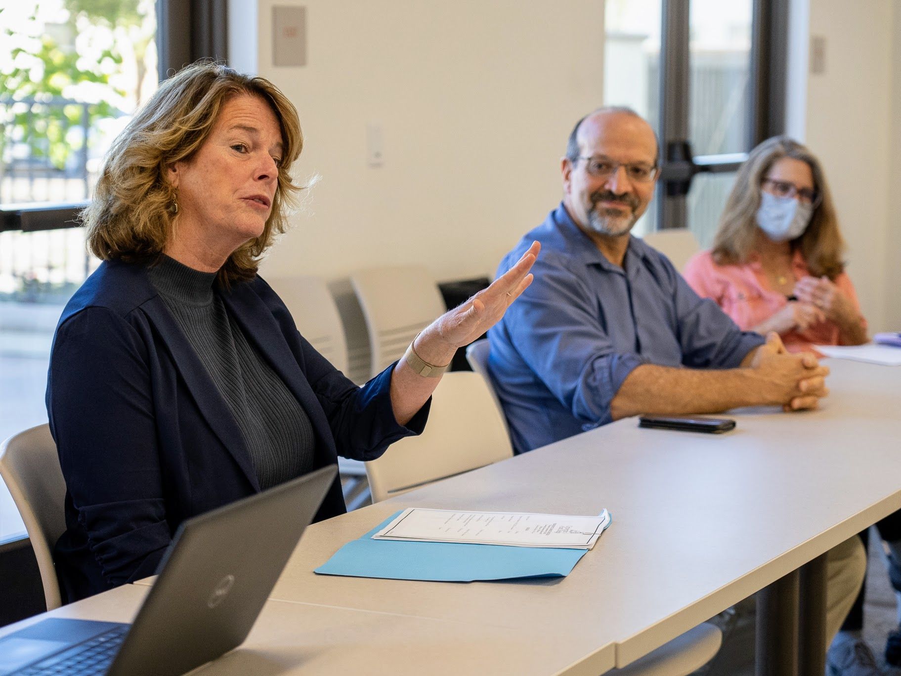 Dean Norton talking with a group of faculty and staff.