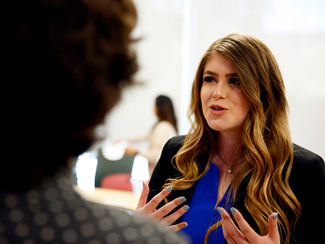 Students talking at a networking event