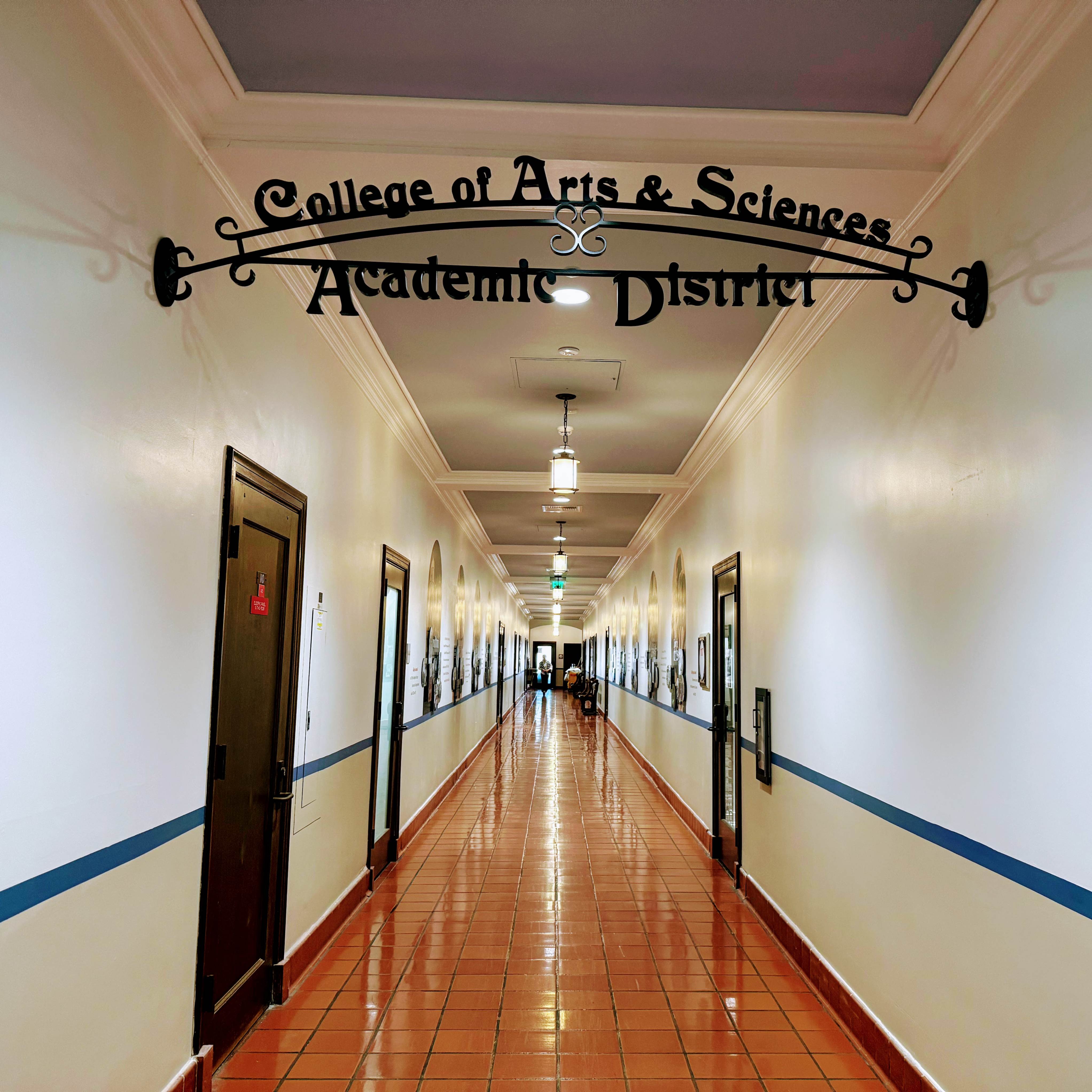 Hallway in Founders Hall with the metal College of Arts and Sciences Academic District