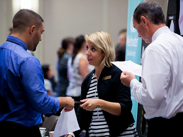 Students networking at an event on the USD campus
