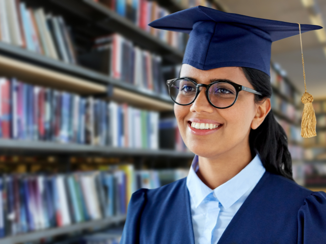 Student wearing a graduation cap and gown.