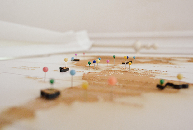 Map with multi-colored pins placed on unknown locations.