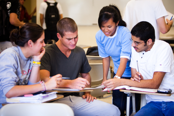 4 USD students working together on an assignment