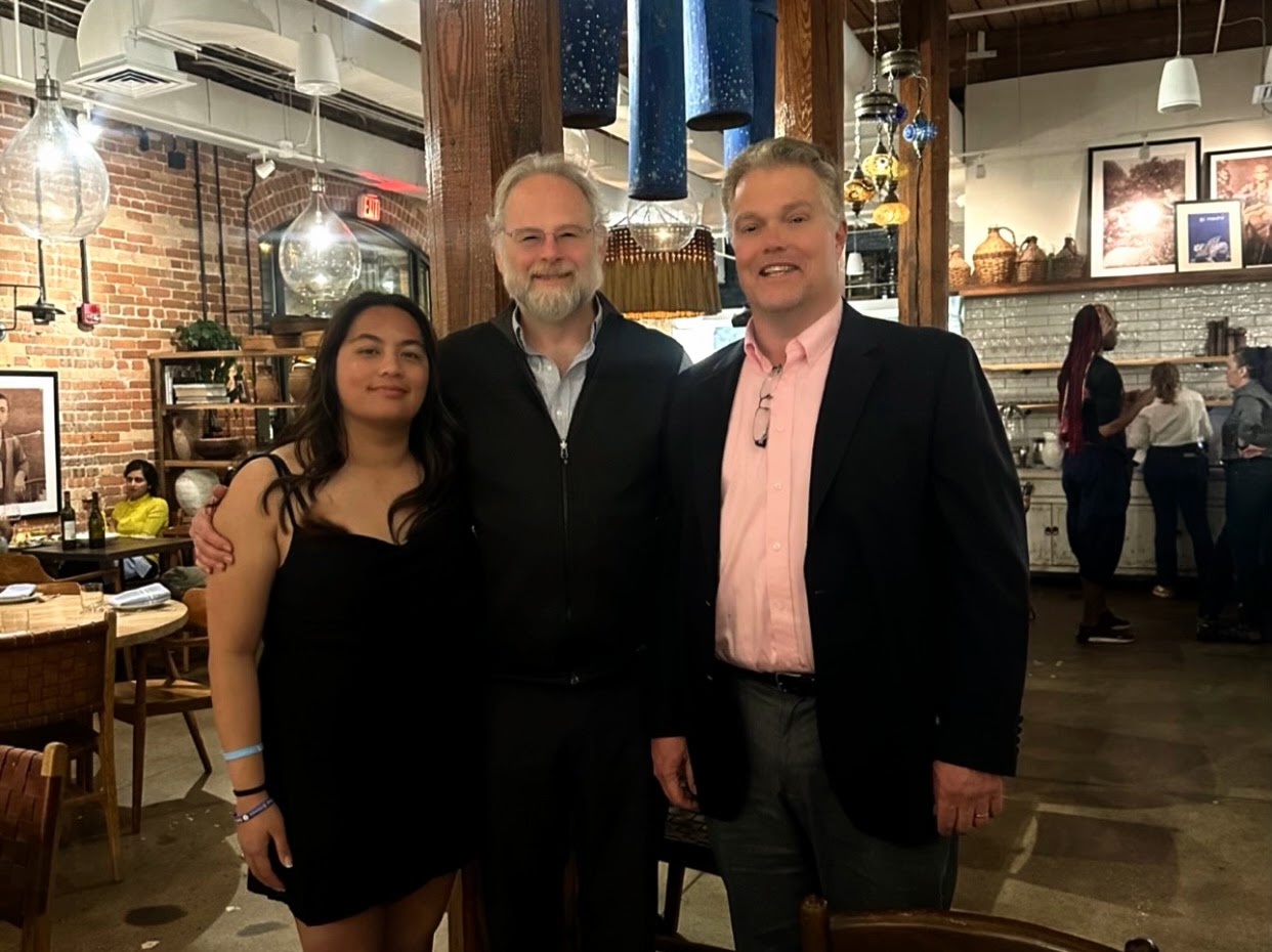 Group photo of 2 professors and USD PPE student, Damiera Cruz, at the 2024 Duke UNC Colloquium.