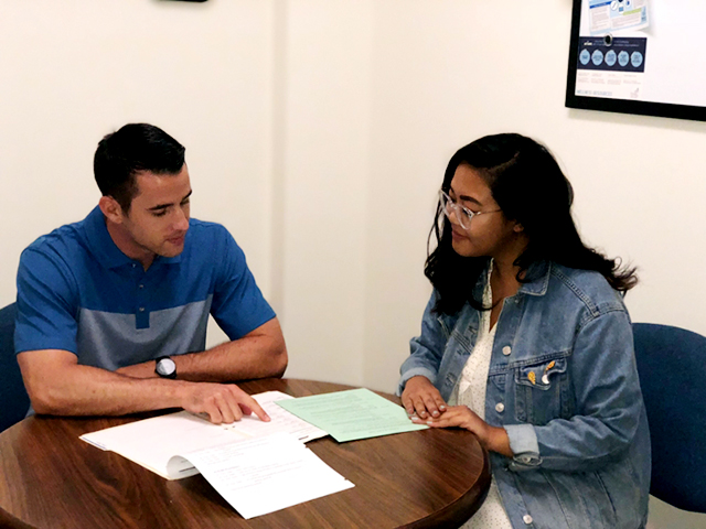 Students meeting in a coaching session