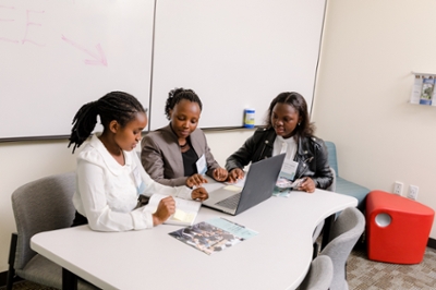 Students sitting at a table working together