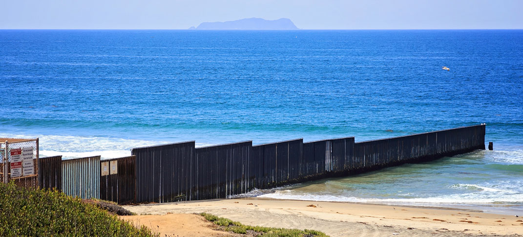 U.S. Mexico border wall where it hits the ocean