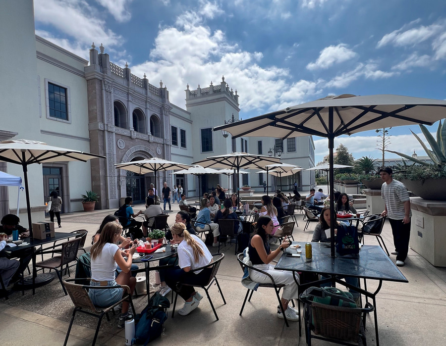 Students having a meal on patio of Bert's Bistro