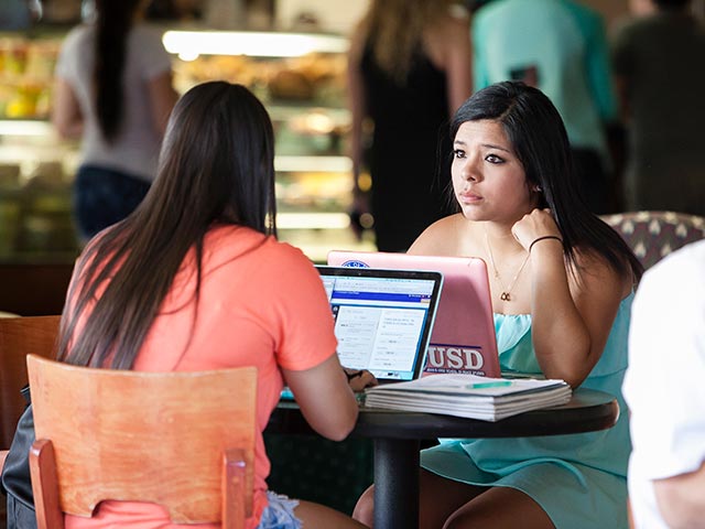 Students talking in Aromas coffee house