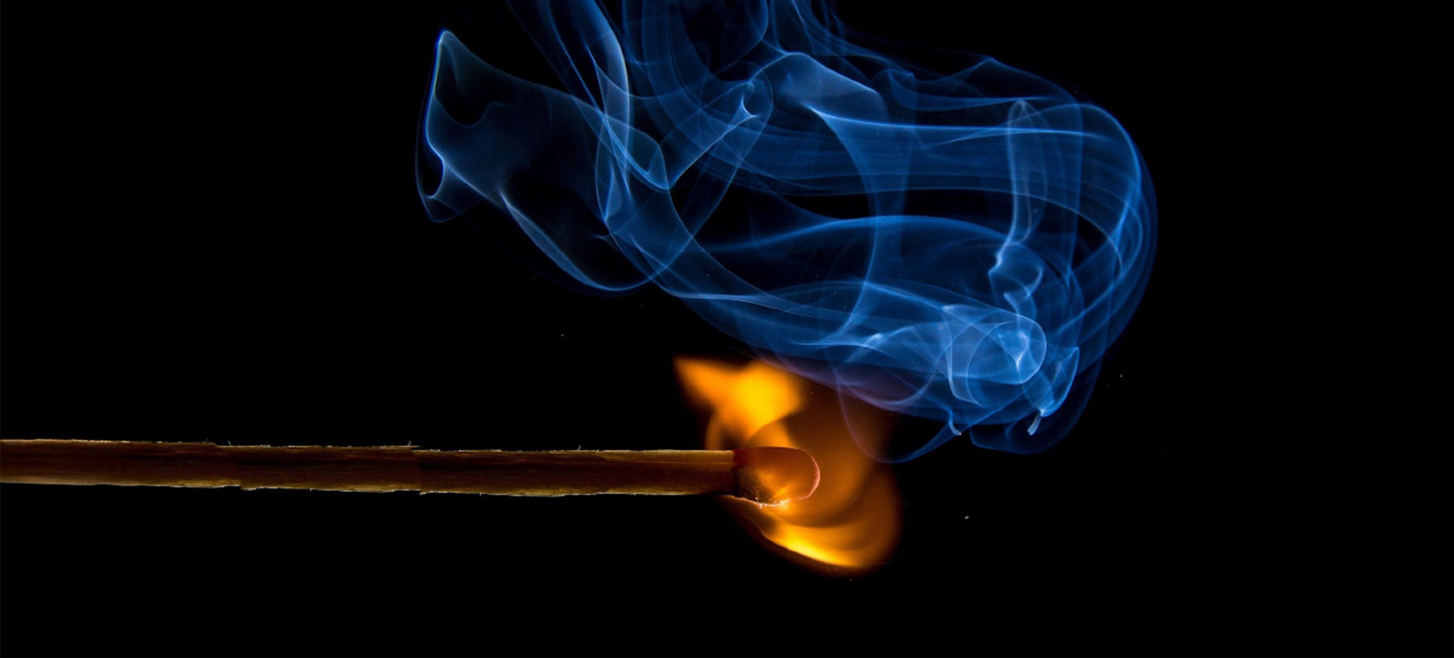 image of match igniting with smoke