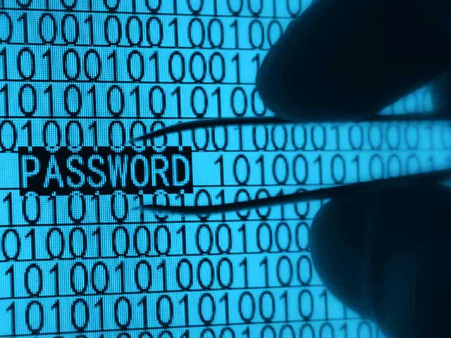 A pair of tweezers looking at code with the word password on the screen
