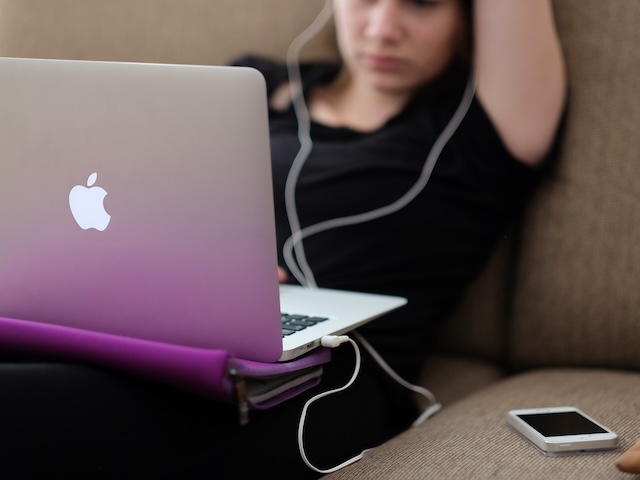 teen using a laptop