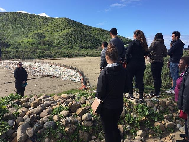 People looking out at a river bed