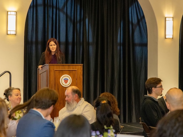 Female speaker at podium