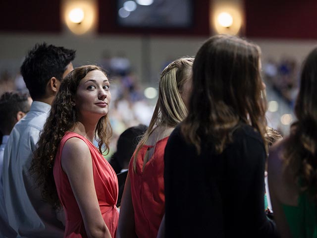 A student in the crowd at the Jenny Craig Pavilion