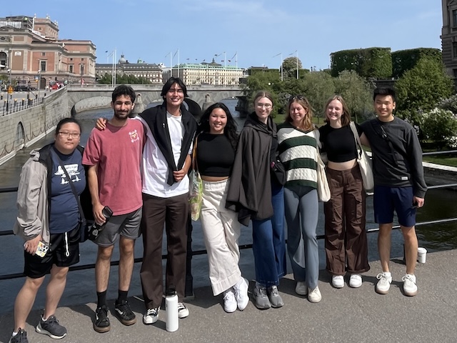 student and faculty outdoors