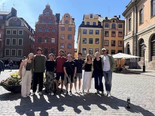 students in front of buildings