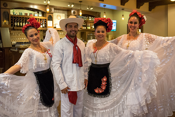 People dressed up as mariachi dancers