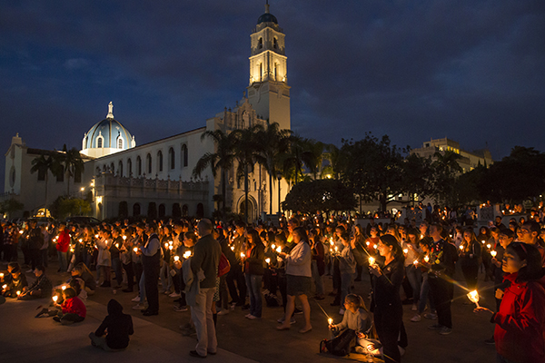 Students at a USD candlelight vigil