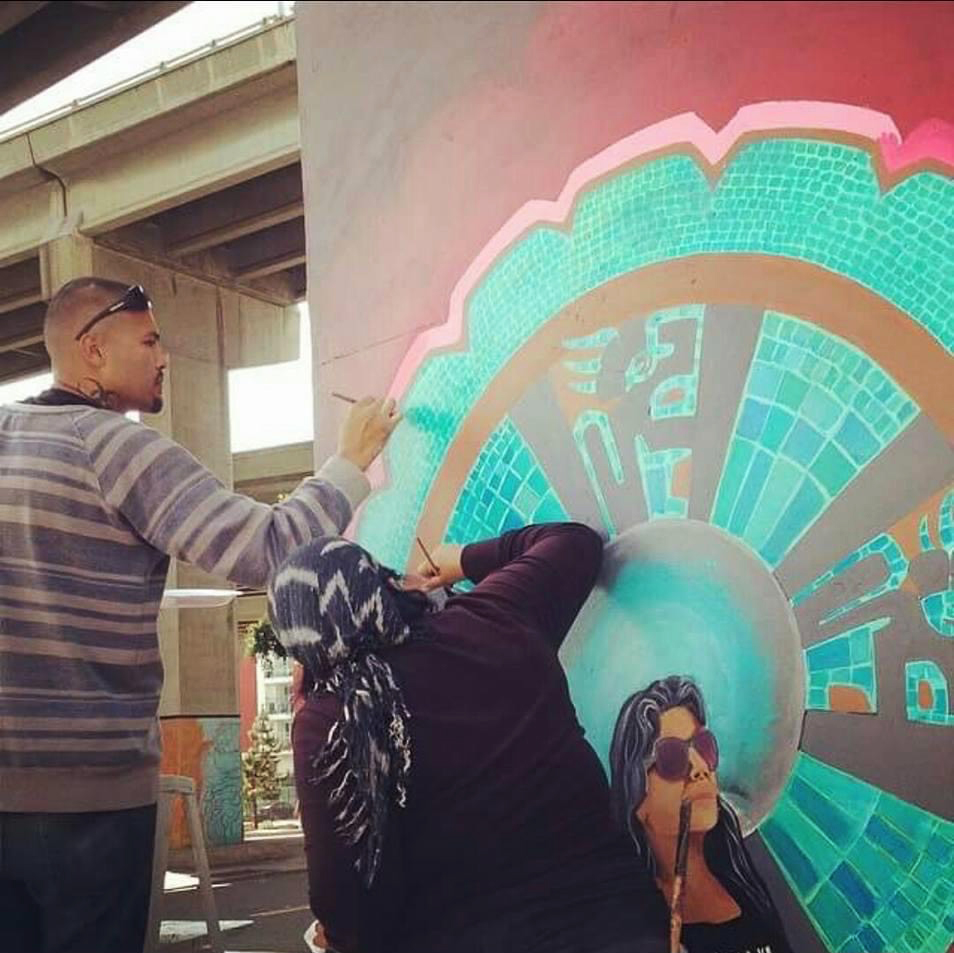 The curator, Cesar, painting his mural in Chicano Park