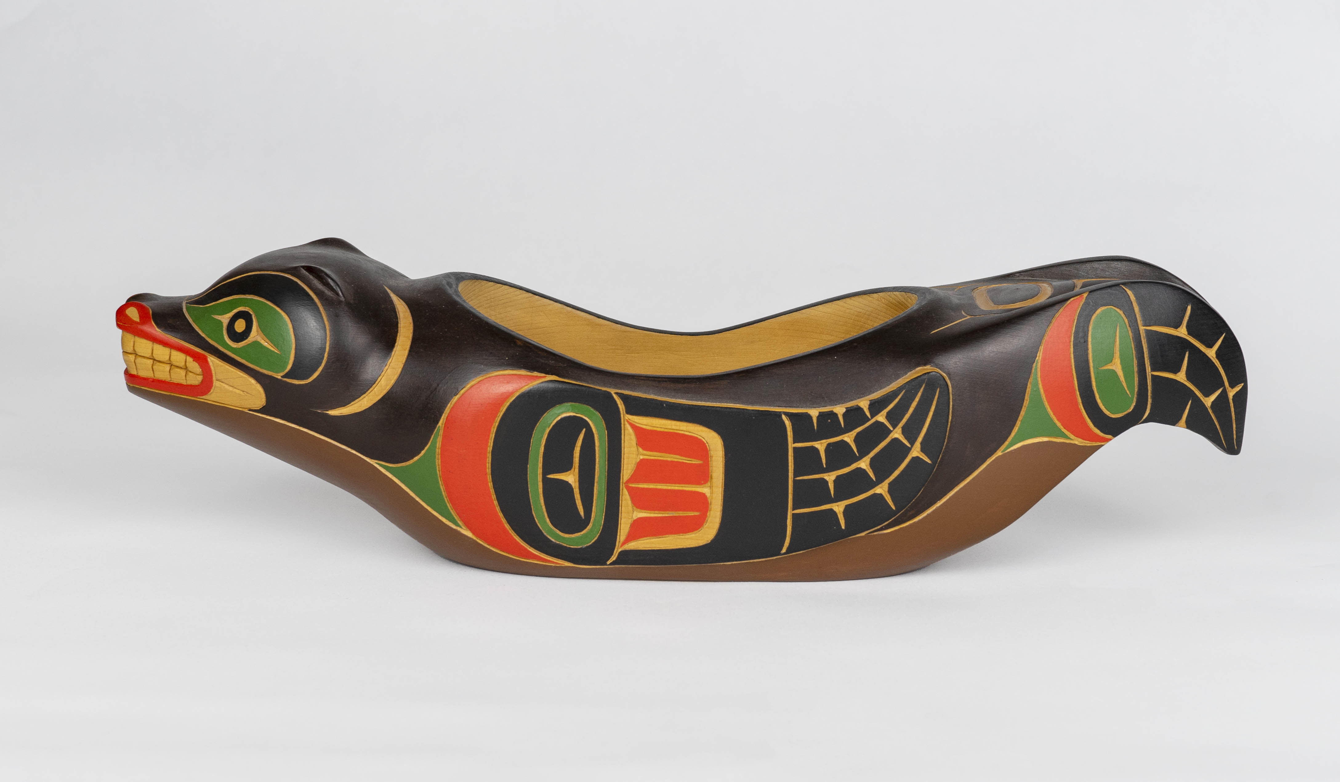 Carved wooden bowl in the shape of a sea lion