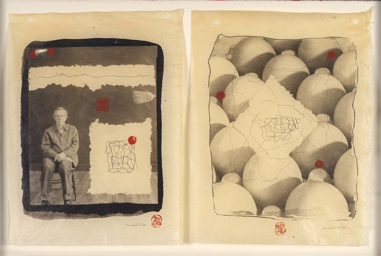 There are two, yellow and black images. The image on the left is of John Cage sitting in a chair with his hands folded on one leg. TO his left and above him are ripped paper rectangles. On the paper is black ink forming one, continuous image of squiggles. The image on the right is a close up of of the tops of eggs in a carton. On top is a ripped rectangular paper with the black ink squiggles.