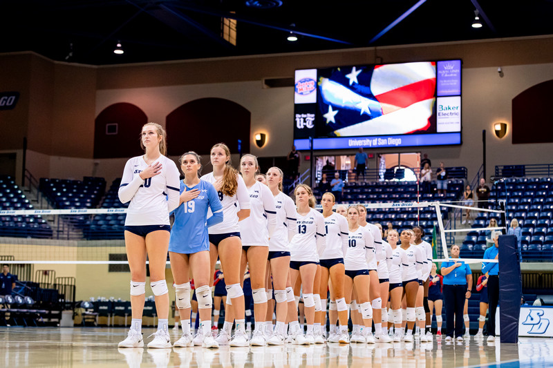 USD women's volleyball players during the National Anthem