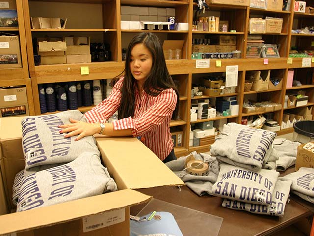 a student working in the USD mail center