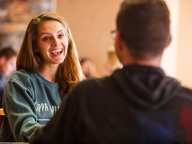 students talking on campus