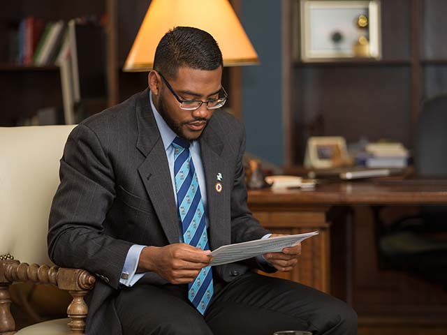 An employee reviewing some paperwork