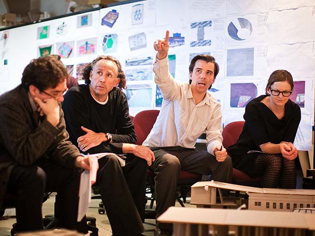 faculty talking in a classroom