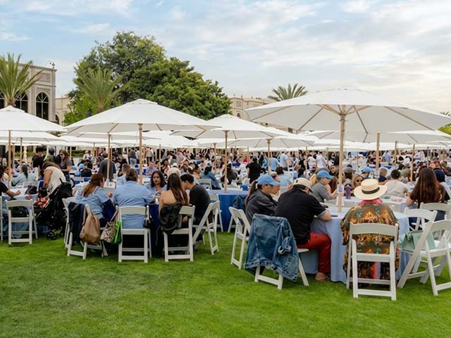 employees sitting at tables at the TEC Fest