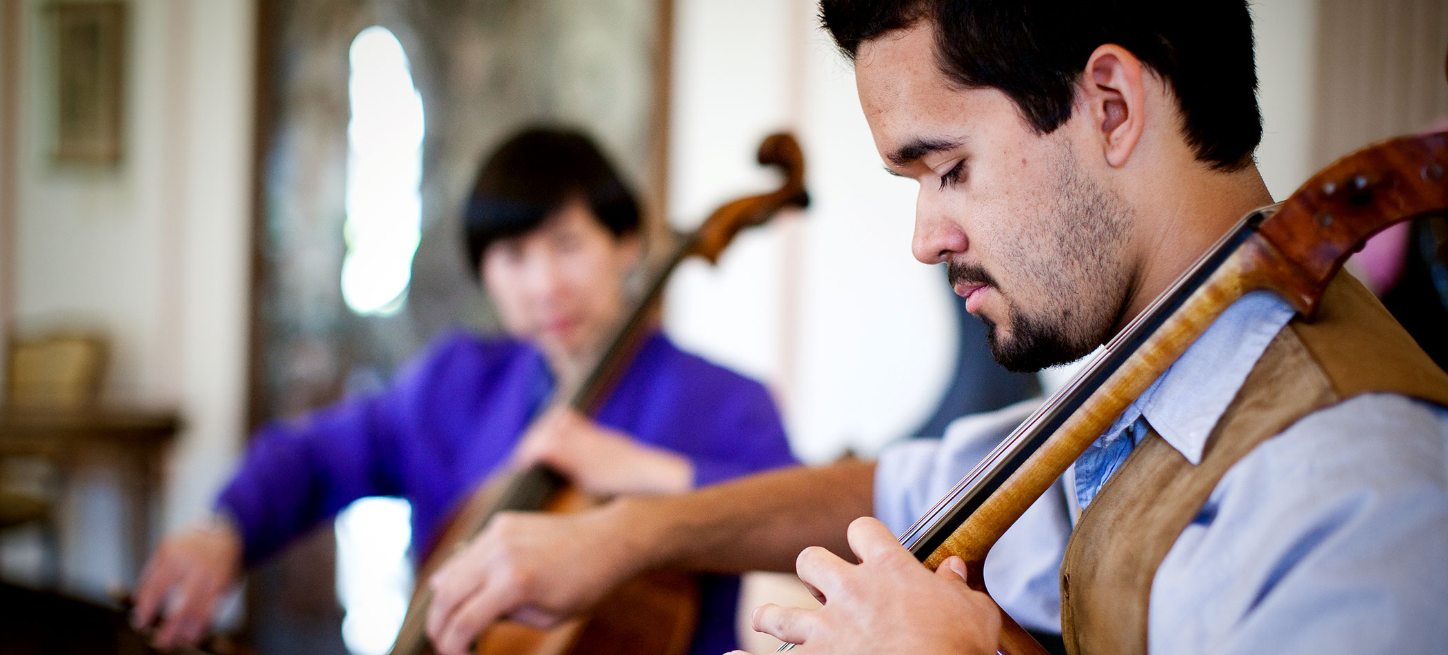 A USD professor and student play the cello