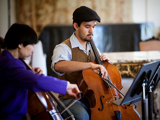 A USD professor and student play the cello