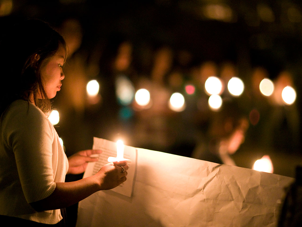 A student at a prayer vigil