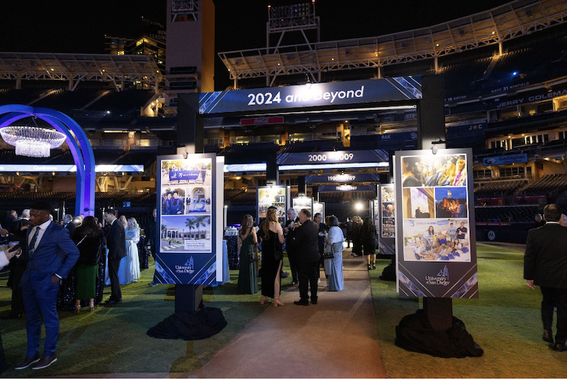 Founders Gala attendees walk through one of the many interactive exhibitions at the event